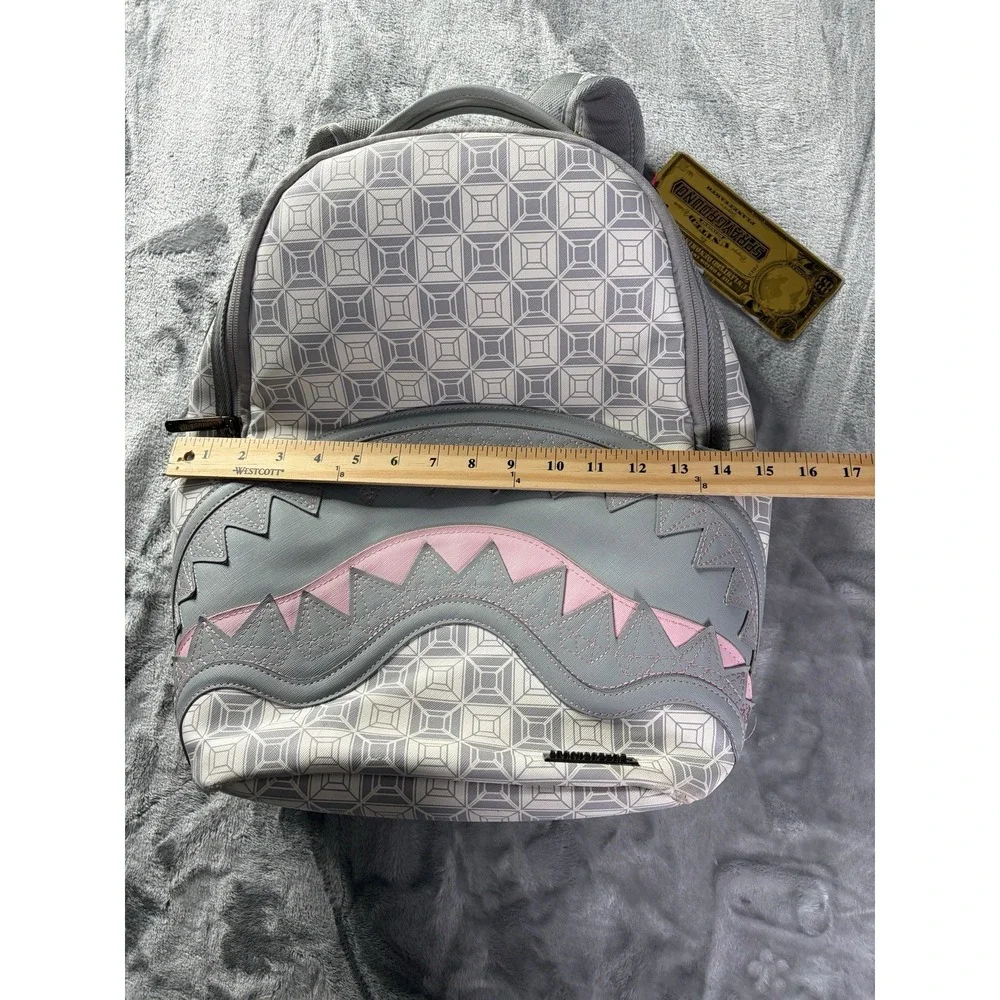 Sprayground A.I. African Intelligence DBX Sandflower Hiking Backpack Gray Pink